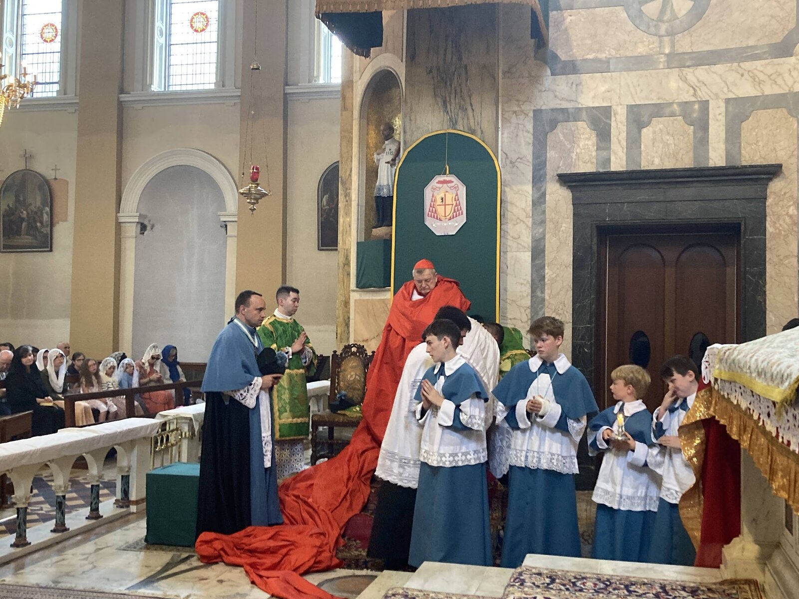 Cardinal in cappa magna with altar servers at Sacred Heart Church, Limerick